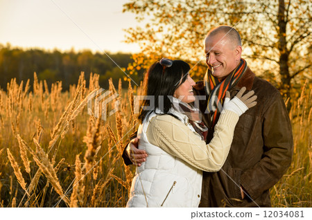 Couple in love hugging in autumn sunset Couple in love hugging in autumn sunset 12034081