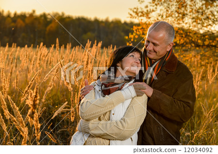 Couple in love embracing in autumn sunset Couple in love embracing in autumn sunset 12034092