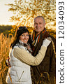 Romantic couple hugging autumn sunset countryside 12034093