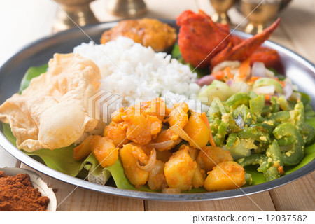 Indian mixed rice on dining table. 12037582