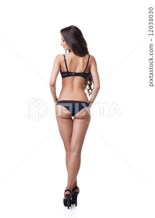 Rear view of suntanned girl in black lingerie Rear view of suntanned girl in black lingerie 12038030