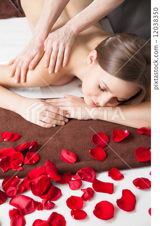 Masseur doing massage on woman body 12038350