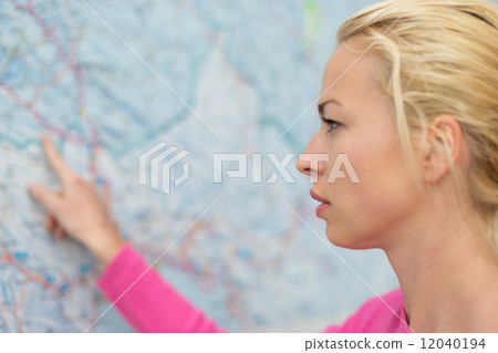 Woman pointing on map. 12040194