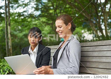 Ladies Working Together in the City 12042482