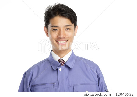 A man wearing work clothes 12046552