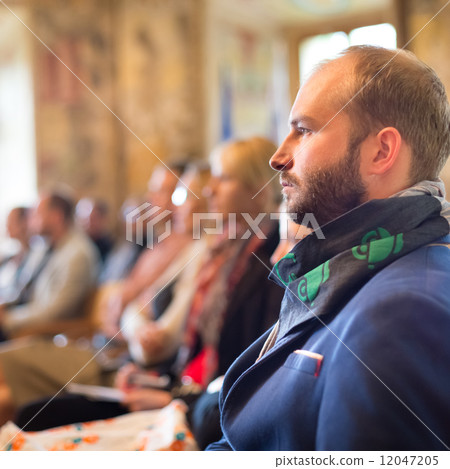 Entrepreneur in audience at business conference. 12047205