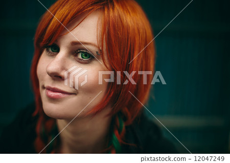 Beautiful red hair girl with deep green eyes 12047249