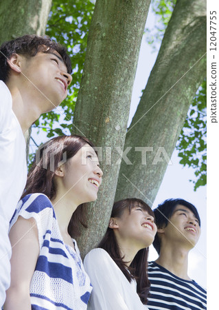 Young people smiling at the park Young people smiling at the park 12047755