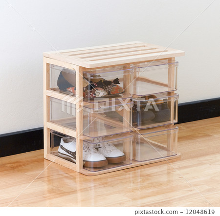 shoe boxes on a wooden stand  12048619