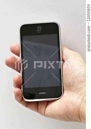 Hand holding smartphone 12050924