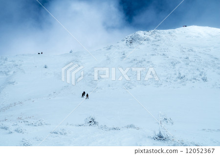 Climbers aiming for white mountaintop 12052367