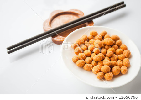 Peanuts snack coated with spicy seasoning and chopsticks Peanuts snack coated with spicy seasoning and chopsticks 12056760