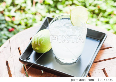 Cold glass of lime juice with lime 12057230