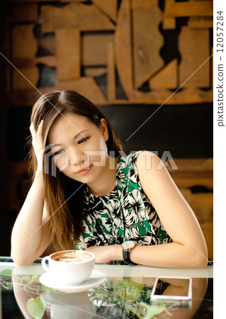 Asian Woman at Cafe 12057284