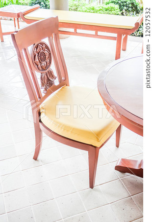 Vacant carving wooden chair in living room Vacant carving wooden chair in living room 12057532
