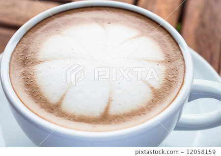 Milk microfoam topped on hot cafe mocha cup Milk microfoam topped on hot cafe mocha cup 12058159