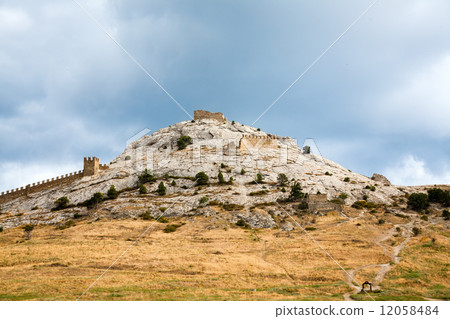 Genoese fortress in Sudak. Evening view. 12058484