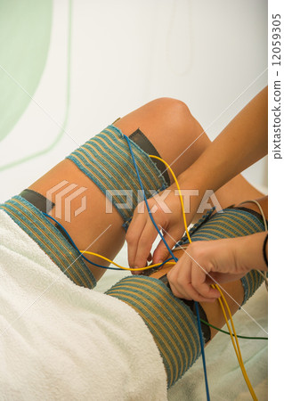 female patient receiving electro threrapy beauty treatment 12059305