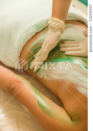 Woman Receiving A Mud Therapy 12059307