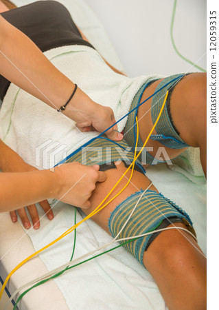 female patient receiving electro threrapy beauty treatment 12059315