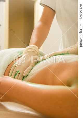 Woman Receiving A Mud Therapy Woman Receiving A Mud Therapy 12059326