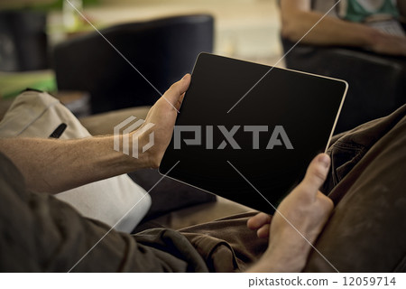 man holding tablet man holding tablet 12059714