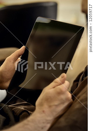 man holding tablet man holding tablet 12059717