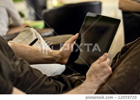 man holding tablet man holding tablet 12059720