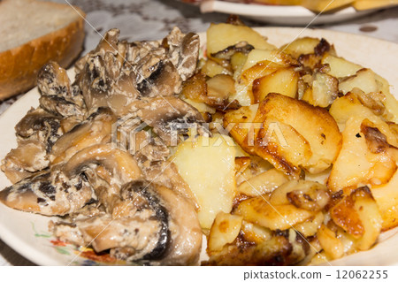 fried potatoes with mushrooms fried potatoes with mushrooms 12062255