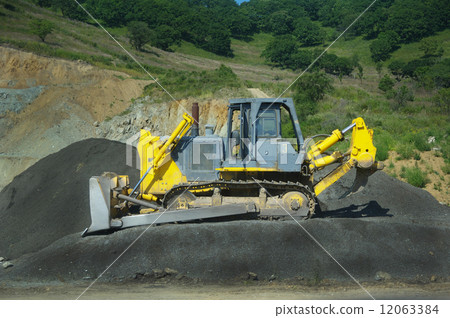 big yellow bulldozer at work-site big yellow bulldozer at work-site 12063384