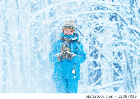 Funny boy caught in a snow storm Funny boy caught in a snow storm 12067839
