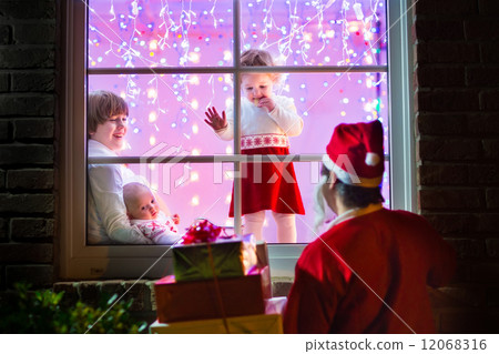 Children watching Santa on Christmas eve 12068316