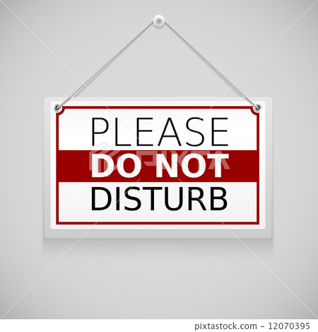 Please do not disturb, sign hanging on the wall 12070395