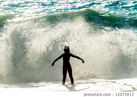 Beautiful Woman in Bikini Standing in the Sea Waves and Enjoying 12073013