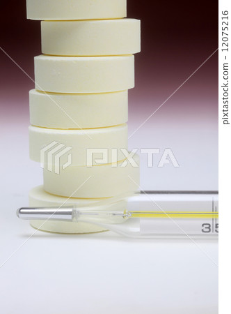 Close-up medical thermometer and pills Close-up medical thermometer and pills 12075216