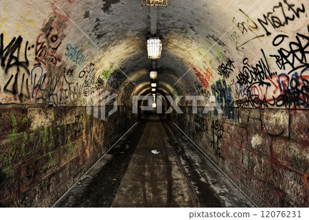 Dark undergorund passage with light Dark undergorund passage with light 12076231