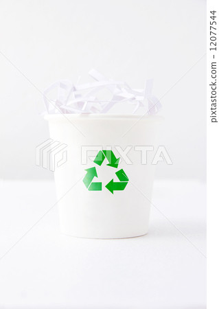 shredded paper in recycle bin 12077544