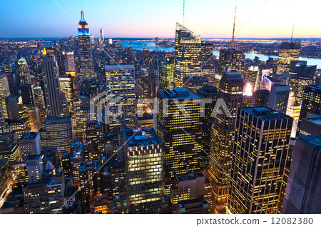 Cityscape view of Manhattan with Empire State Building at night Cityscape view of Manhattan with Empire State Building at night 12082380