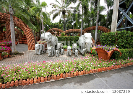 Elephants and flowers and pots in the Nong Nooch tropical botanic garden near Pattaya city Elephants and flowers and pots in the Nong Nooch tropical botanic garden near Pattaya city 12087259