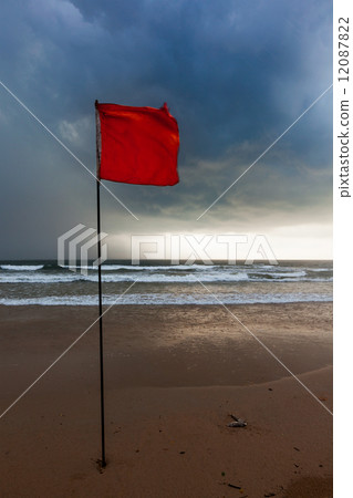 Storm warning flags on beach. Baga, Goa, India 12087822