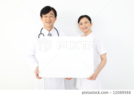 Doctors and nurses with whiteboard 12089568