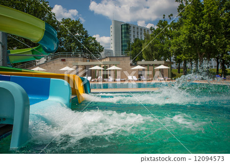 person riding down a water slide 12094573