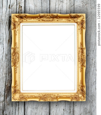 blank golden frame on wood wall 12095599