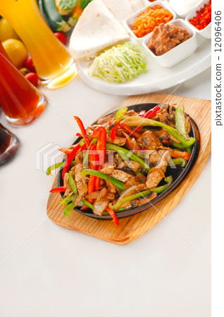 original fajita sizzling hot  on iron plate 12096406