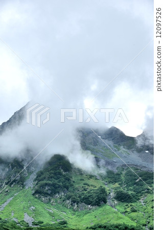 Hodaka mountain peak in the cloud 12097526
