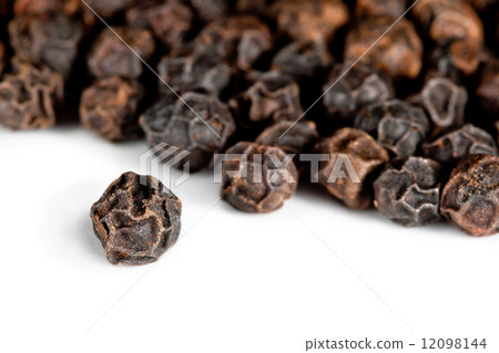 Black pepper on a white background Black pepper on a white background 12098144