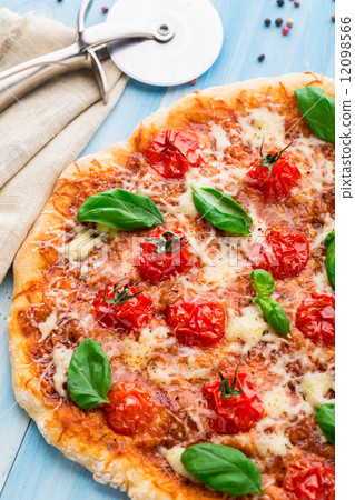 Pizza with cherry tomatoes and basil 12098566