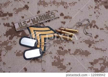 US  Marines concept with service tapes, dog tags and camouflaged uniform 12099942