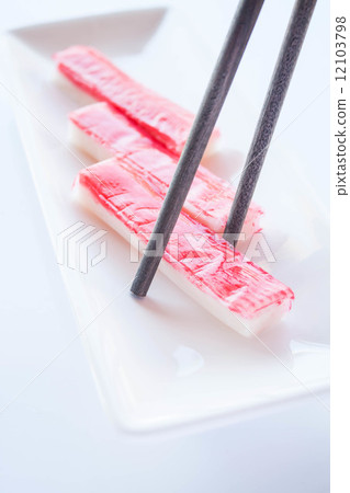 Crab sticks group and wood chopsticks on white plate 12103798