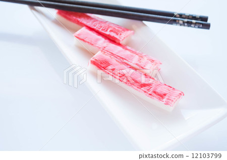 Crab sticks group with chopsticks on white plate 12103799